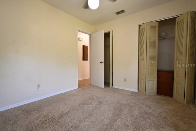 unfurnished bedroom featuring visible vents, baseboards, ceiling fan, and carpet flooring