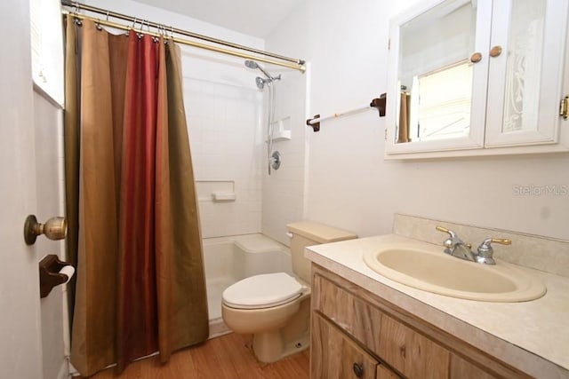 full bath with curtained shower, toilet, wood finished floors, and vanity