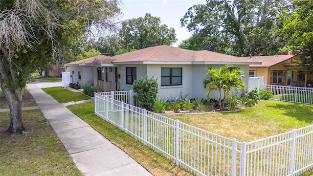 ranch-style home with a front yard