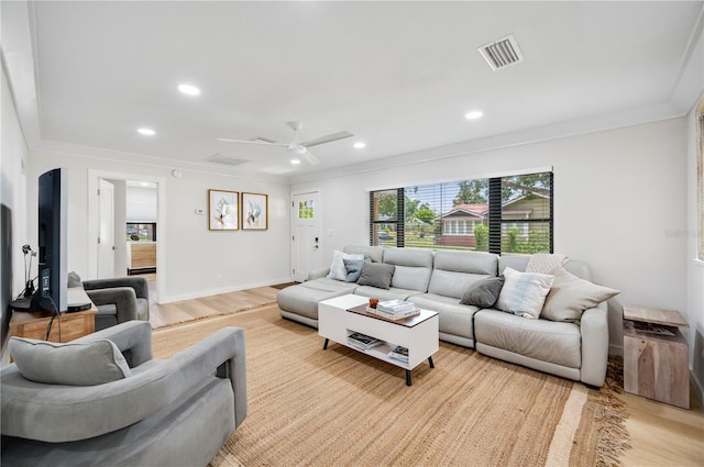 living room featuring ceiling fan and light wood-type flooring