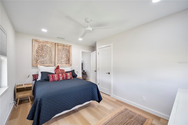 bedroom featuring light hardwood / wood-style floors and ceiling fan