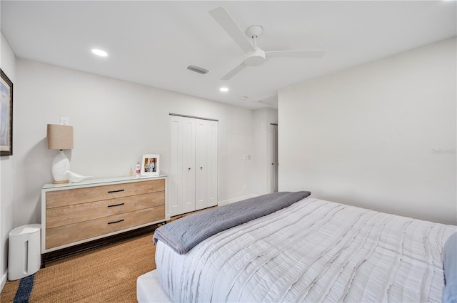 bedroom featuring ceiling fan and a closet