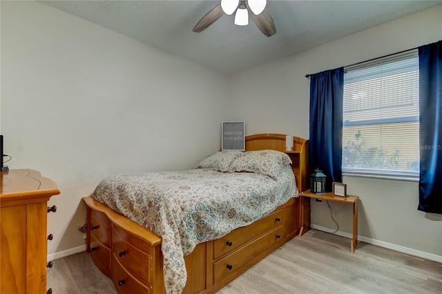 bedroom featuring ceiling fan and light hardwood / wood-style flooring