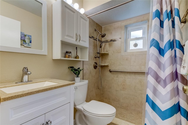 bathroom featuring a shower with curtain, vanity, and toilet