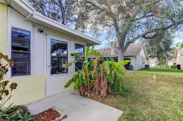 entrance to property with a yard