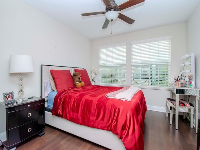 bedroom featuring ceiling fan and dark hardwood / wood-style floors