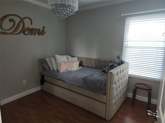 bedroom featuring an inviting chandelier, crown molding, multiple windows, and hardwood / wood-style flooring