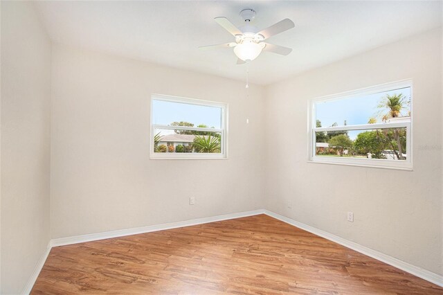 unfurnished room featuring ceiling fan and light hardwood / wood-style flooring