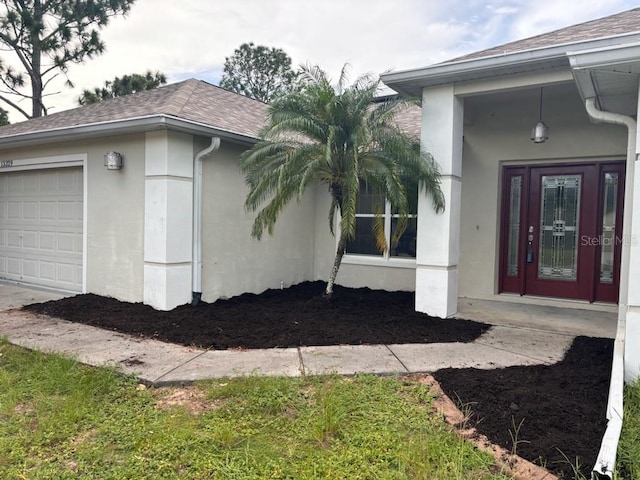 property entrance featuring a garage