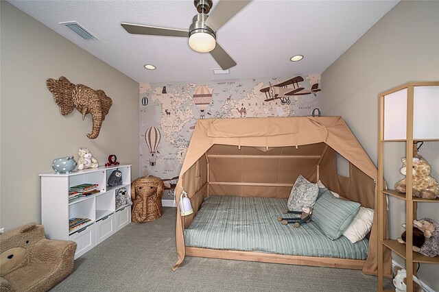 carpeted bedroom featuring ceiling fan