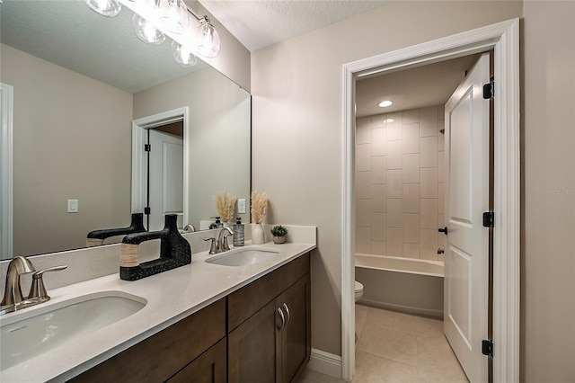 full bathroom featuring shower / bath combination, dual vanity, a textured ceiling, tile patterned floors, and toilet