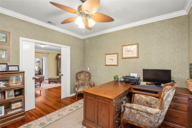 office space with ceiling fan, light hardwood / wood-style floors, and ornamental molding