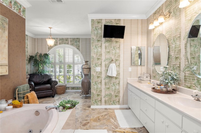 bathroom featuring a bathing tub, vanity, and ornamental molding