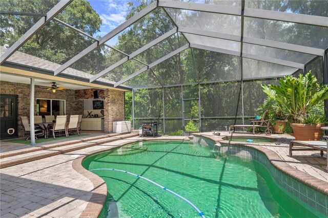 view of pool with a patio and ceiling fan