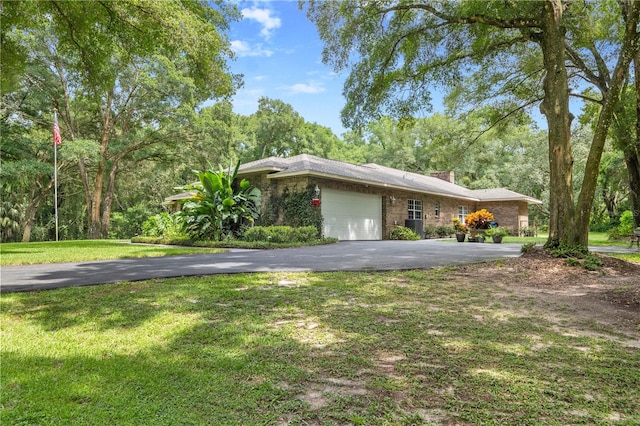 view of side of property with a garage and a yard