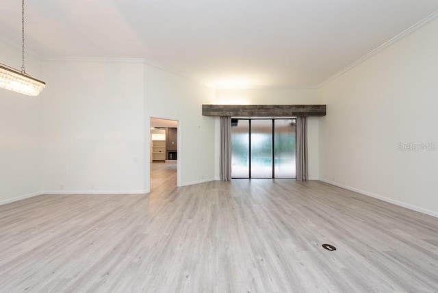 empty room with crown molding, elevator, and light wood-type flooring