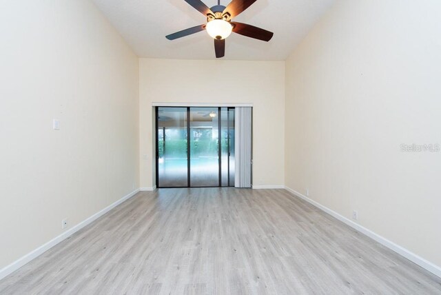 empty room featuring light wood-type flooring and ceiling fan