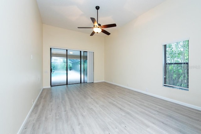 spare room with ceiling fan and light wood-type flooring