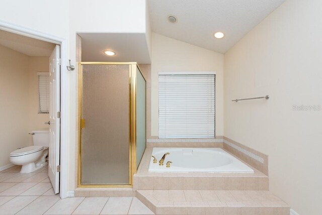 bathroom with independent shower and bath, toilet, tile patterned flooring, and vaulted ceiling