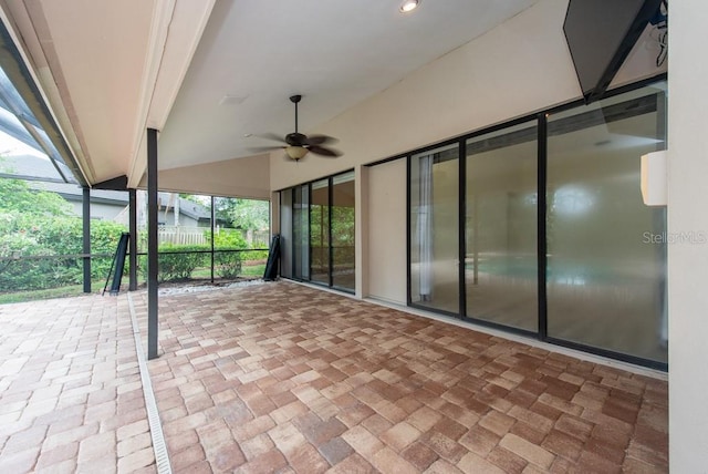 view of patio / terrace with a lanai and ceiling fan