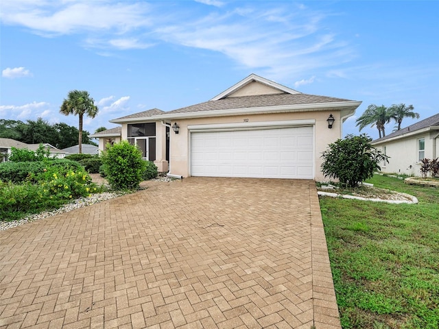 single story home featuring a garage