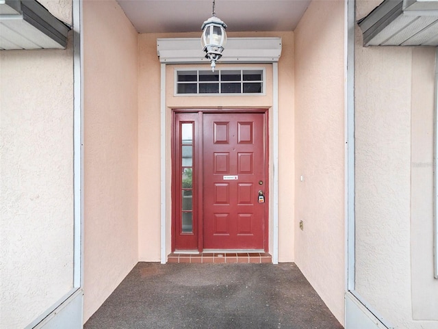 doorway to property featuring a wall unit AC