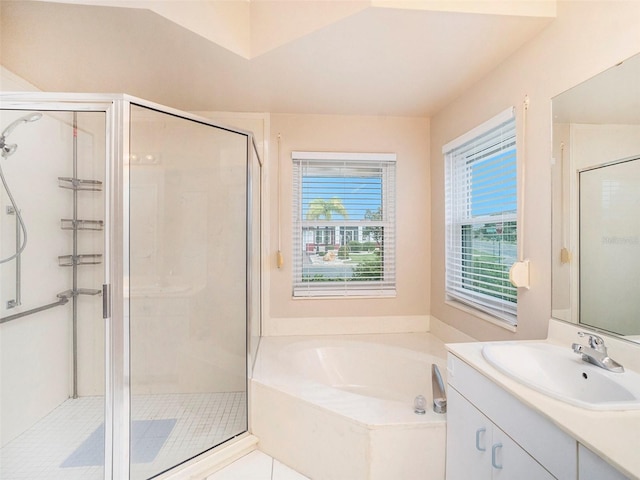 bathroom featuring tile patterned flooring, plus walk in shower, and vanity