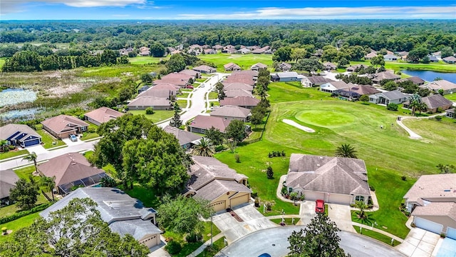 bird's eye view with view of golf course, a water view, and a residential view