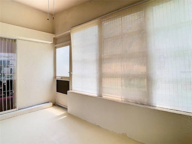 unfurnished room featuring concrete flooring