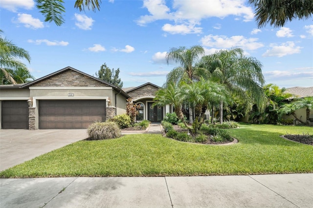 ranch-style house with a garage and a front lawn