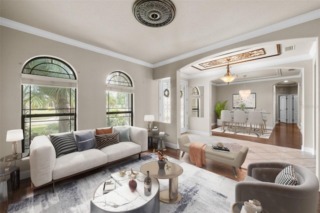 living room featuring crown molding and hardwood / wood-style floors