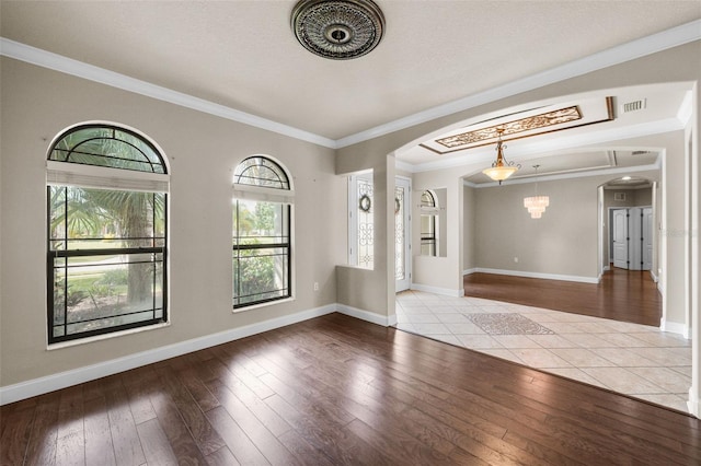 tiled entrance foyer with crown molding