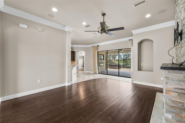 unfurnished living room with ornamental molding, a textured ceiling, ceiling fan, and light hardwood / wood-style floors