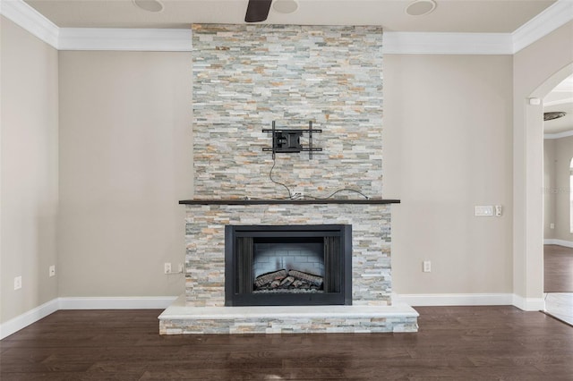 details with ceiling fan, a fireplace, hardwood / wood-style floors, and ornamental molding