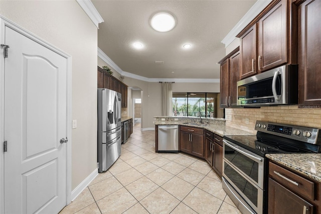 kitchen with stainless steel appliances, decorative backsplash, crown molding, sink, and light stone counters