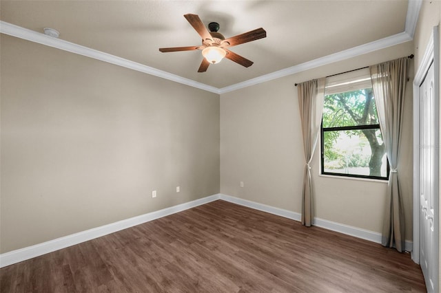 unfurnished room with ornamental molding, hardwood / wood-style flooring, and ceiling fan