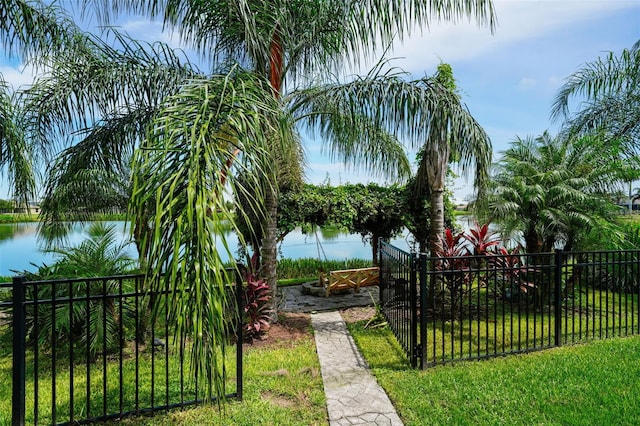 exterior space featuring a water view and a lawn