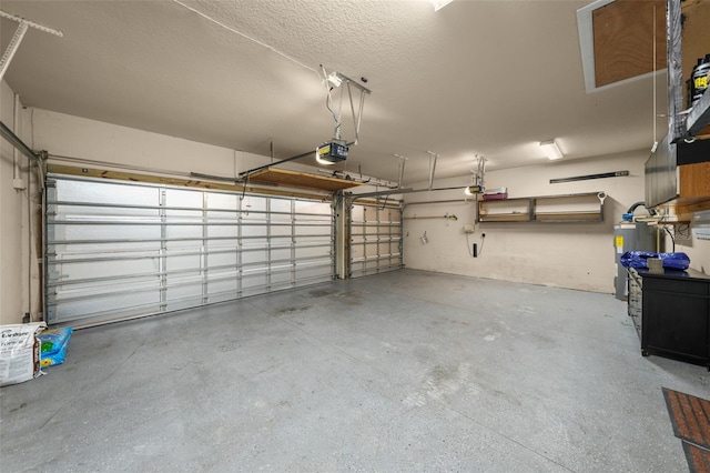 garage featuring electric water heater and a garage door opener