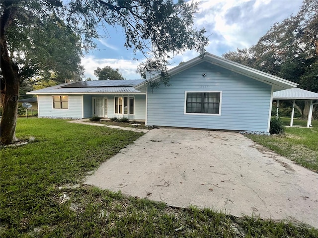 ranch-style home with a front yard and a porch