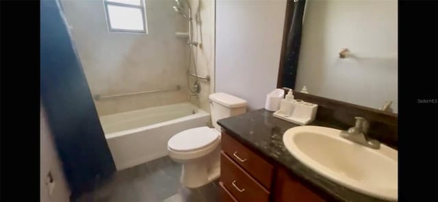 bathroom featuring  shower combination, vanity, and toilet