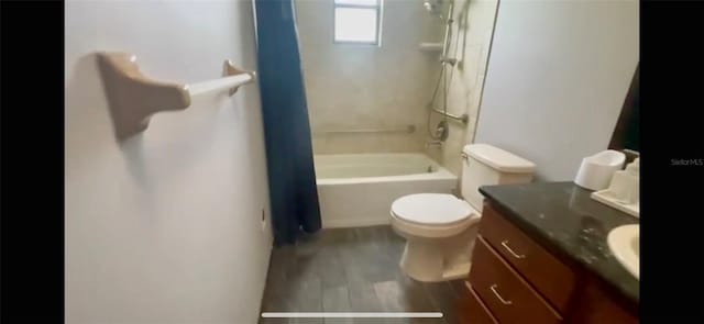 full bathroom with wood-type flooring, vanity, toilet, and shower / bath combo