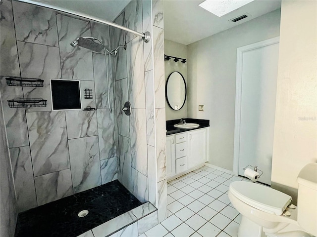 bathroom featuring visible vents, toilet, vanity, and a marble finish shower