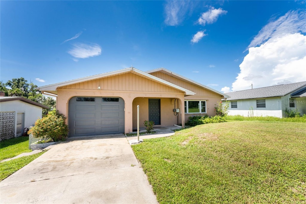 29171 Orva Dr, Punta Gorda, FL 33982 - ranch-style house featuring a garage and a front yard