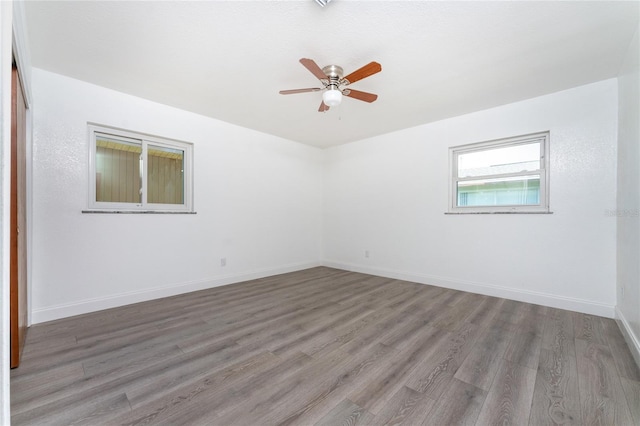 unfurnished room with wood-type flooring and ceiling fan