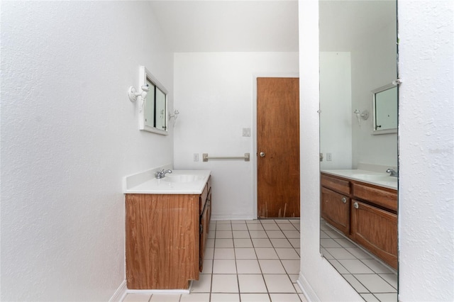 bathroom featuring dual vanity and tile patterned floors