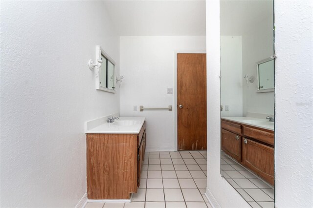 bathroom featuring tile patterned flooring and vanity