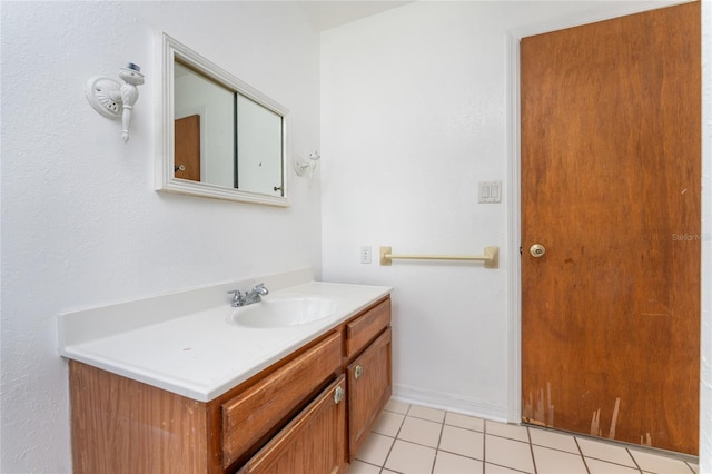 bathroom with vanity and tile patterned flooring