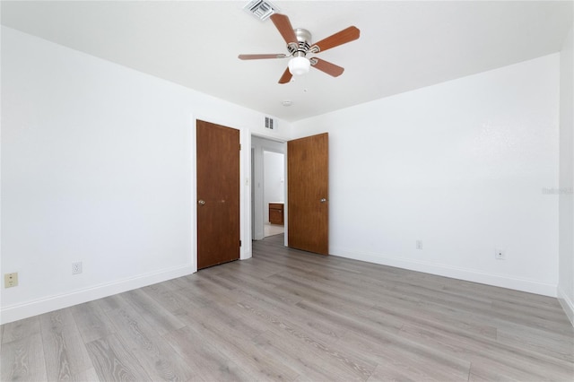 unfurnished room with ceiling fan and light wood-type flooring