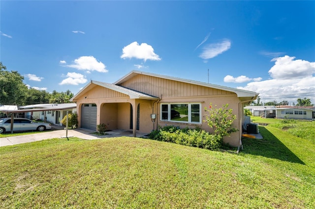 view of front of house with a garage and a front lawn