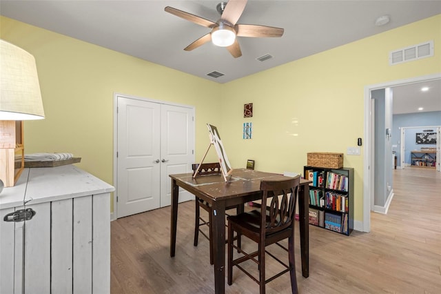 dining space featuring ceiling fan and light hardwood / wood-style flooring